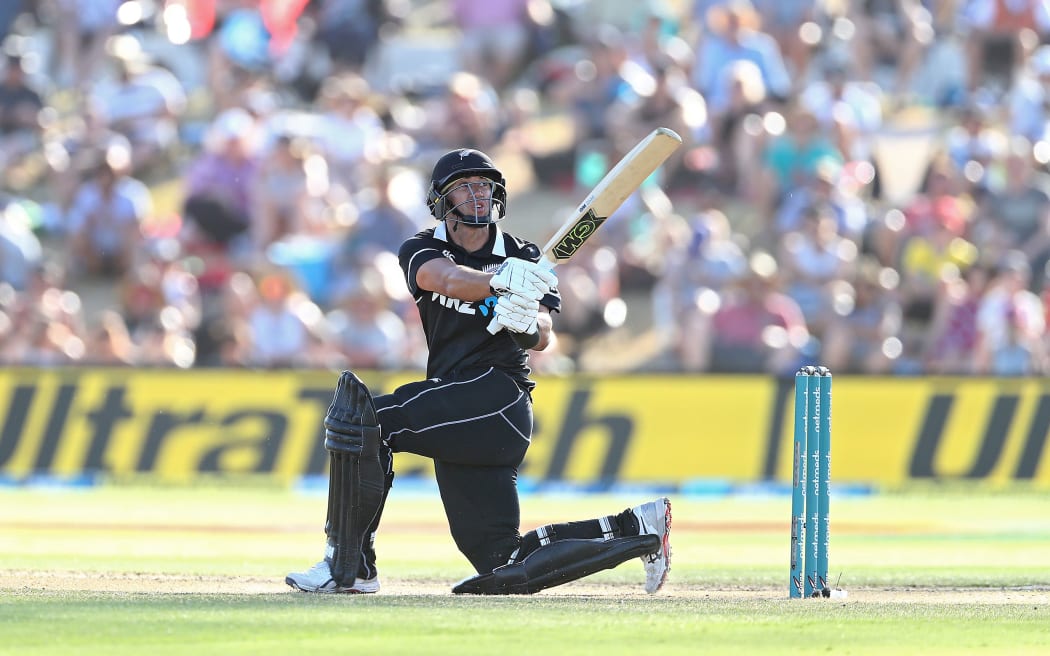 Ross Taylor watches the ball as it goes for 4 runs.