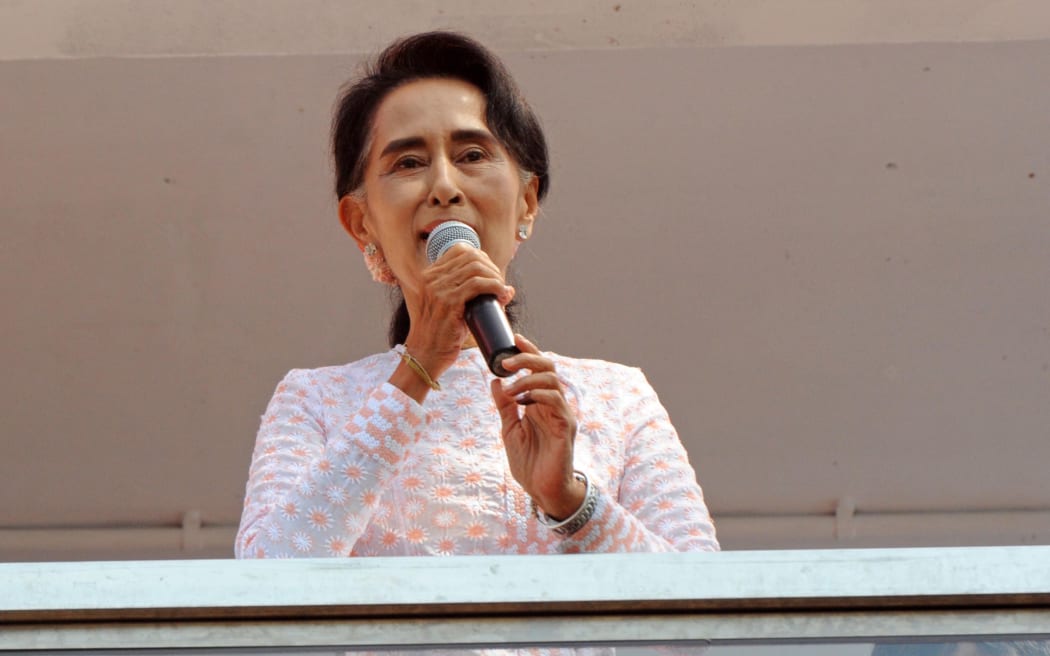 Aung San Suu Kyi, at NLD headquarters in Yangon, urged followers to be patient.