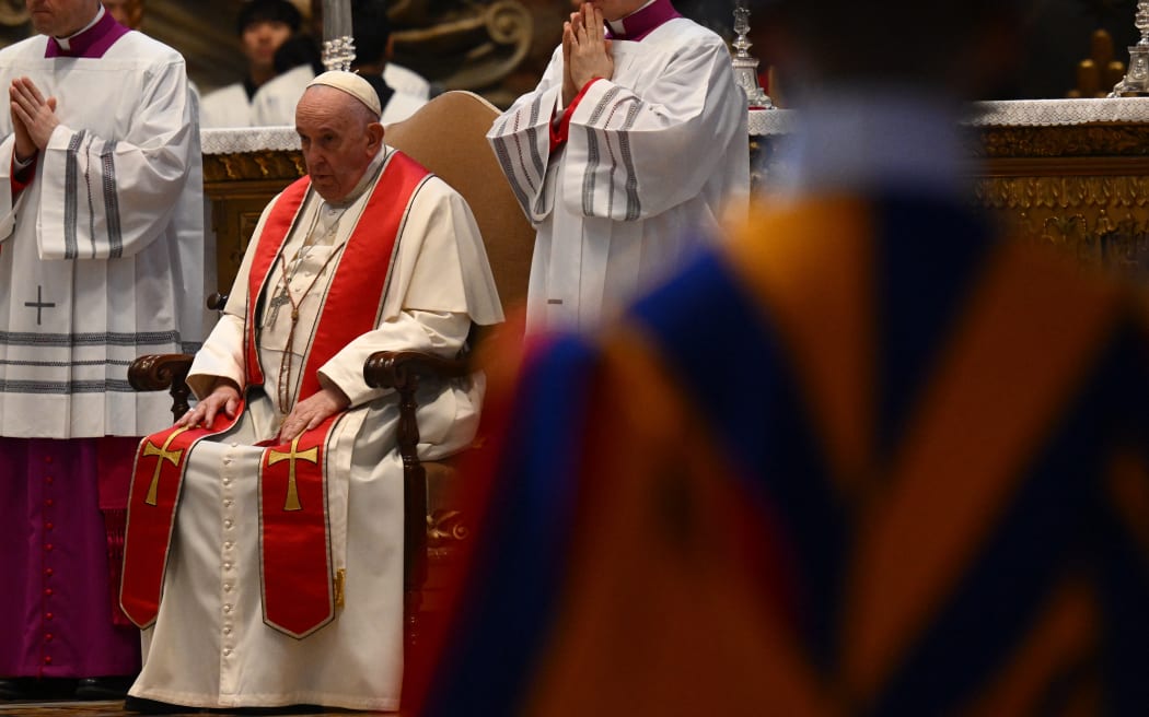 Pope Francis attends a funeral mass for Australia's Cardinal George Pell, in the St. Peter’s basilica at the Vatican on January 14, 2023. - Cardinal George Pell, a senior figure in the Catholic Church who was convicted and later cleared of sexual abuse in Australia, has died in Rome aged 81, a church official confirmed on January 11. (Photo by Vincenzo PINTO / AFP)