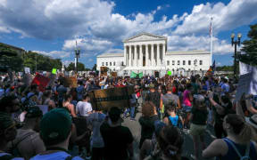 Protesters gather outside the US Supreme Court in Washington DC, following the reversal of Roe vs Wade.