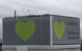 Balloons are released from the top of Grenfell Tower on the anniversary of the Grenfell fire in west London on June 14.