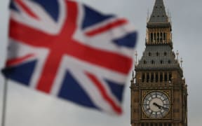 A Union flag flies near Big Ben, and the Houses of Parliament .