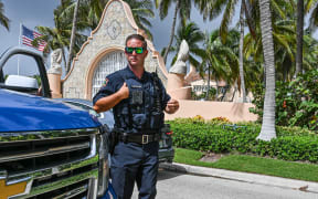 Local law enforcement officers are seen in front of the home of former President Donald Trump at Mar-A-Lago in Palm Beach, Florida on August 9, 2022.