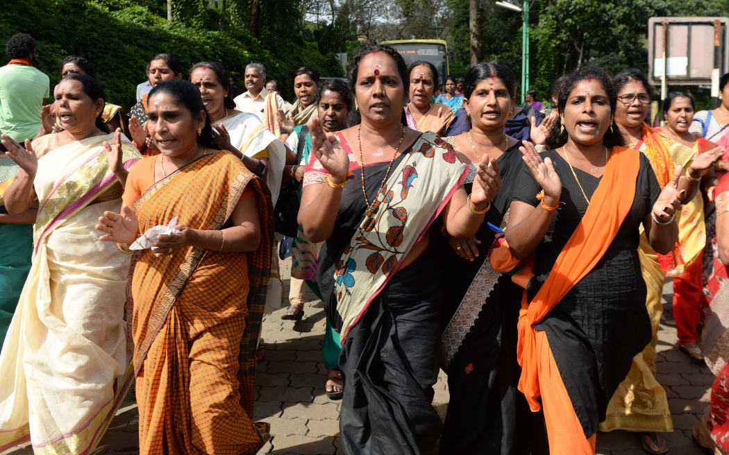 Indian Hindu devotees and activists protesting a Supreme Court verdict revoking a ban on women's entry to Sabarimala's Ayyappa Hindu temple, in Keralal.