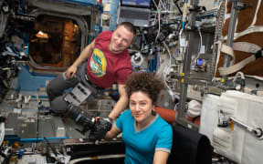 NASA astronauts Andrew Morgan and Jessica Meir photographing earth from the International Space Station, in March.