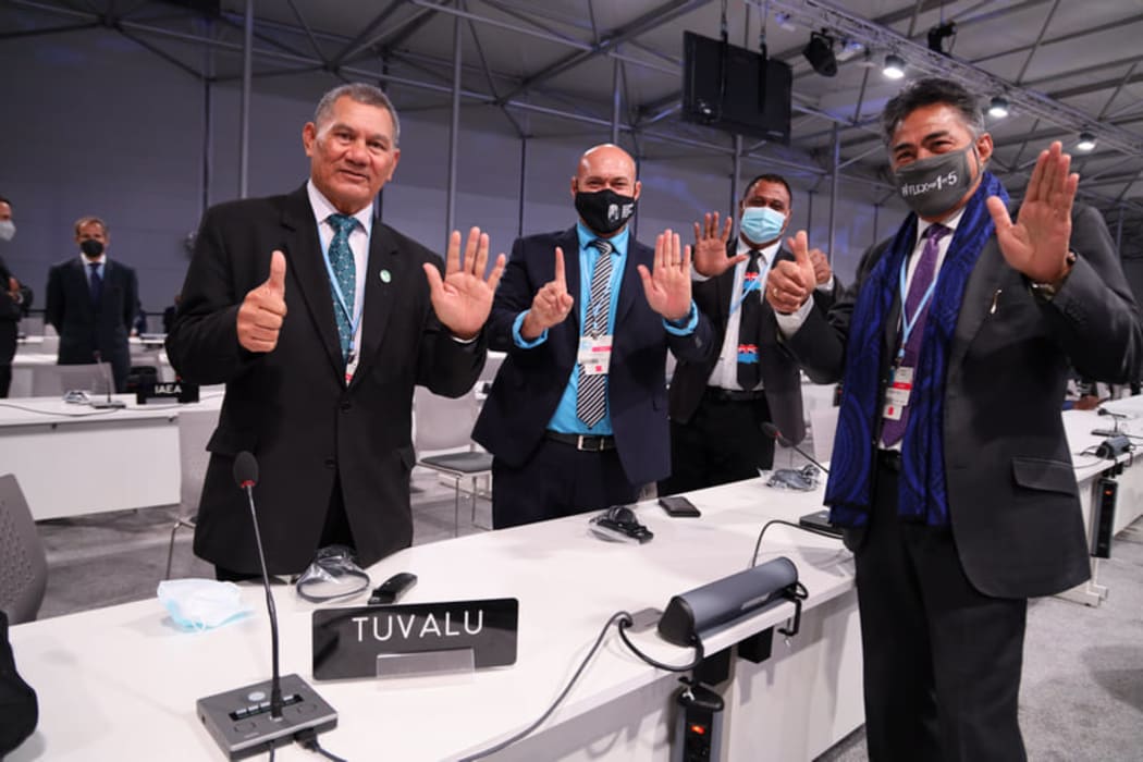 Tuvalu delegation to COP26, including Prime Minister Natano, with Ambassador Luteru.