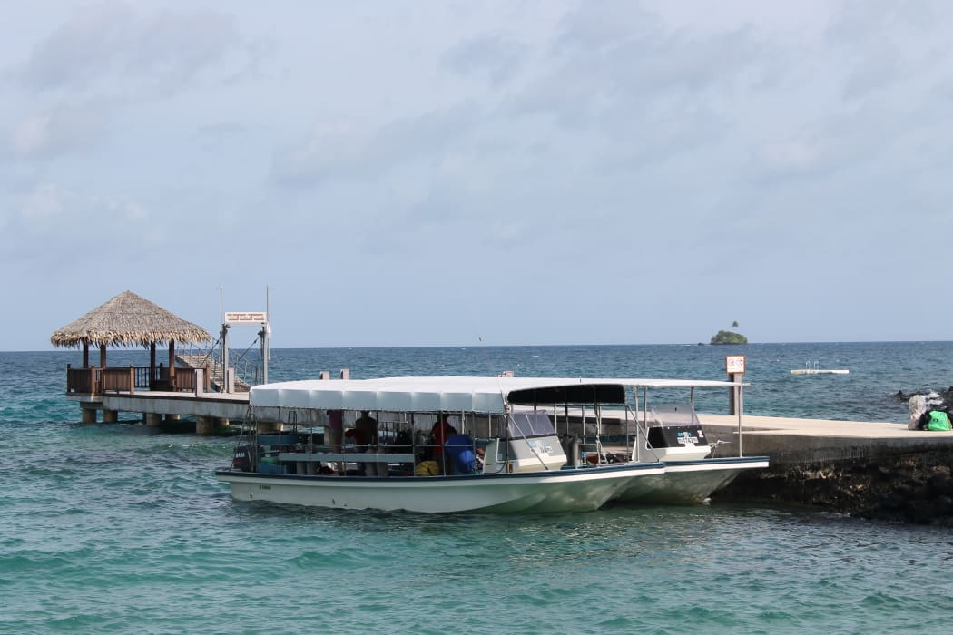 A tourist boat at a wharf in Palau