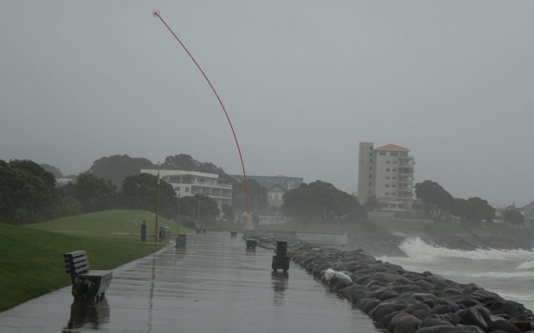 The Len Lye Wind Wand sculpture bows to the strong northeasterly in New Plymouth.