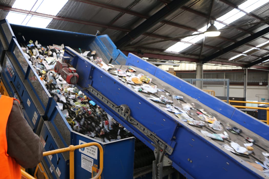 Fresh off the truck, recycling going onto the first conveyor belts to begin the sorting process at Oji.