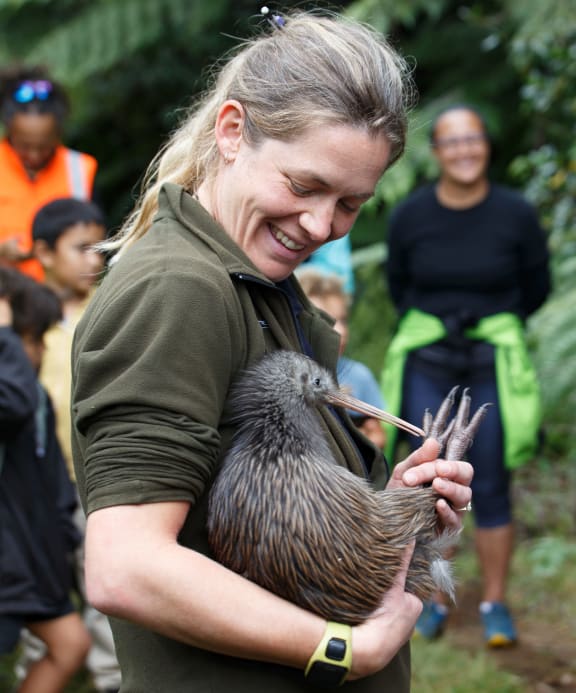 Rotokare conservation manager Fiona Gordon holding a kiwi