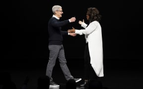 Apple CEO Tim Cook and Oprah Winfrey during an event at the Steve Jobs Theatre to unveil its new streaming platform. March 25, 2019, in Cupertino, Calif.