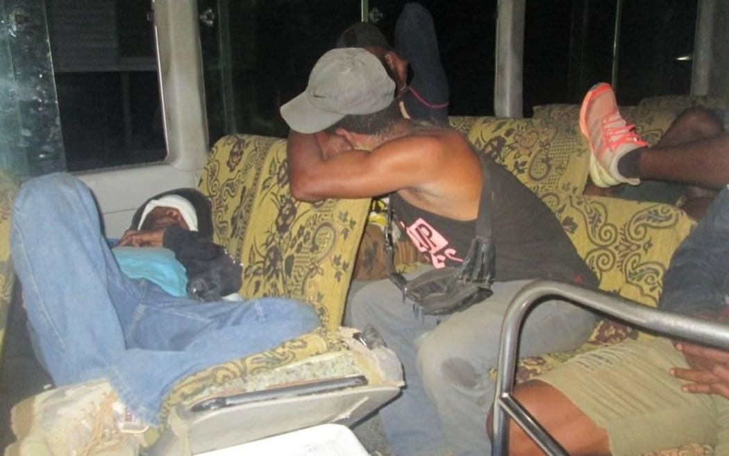 Blue Kumuls players sleeping on the bus.