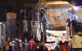 This picture taken on December 28, 2018 shows a tourist bus which was attacked being towed away from the scene, in Giza province south of the Egyptian capital Cairo.