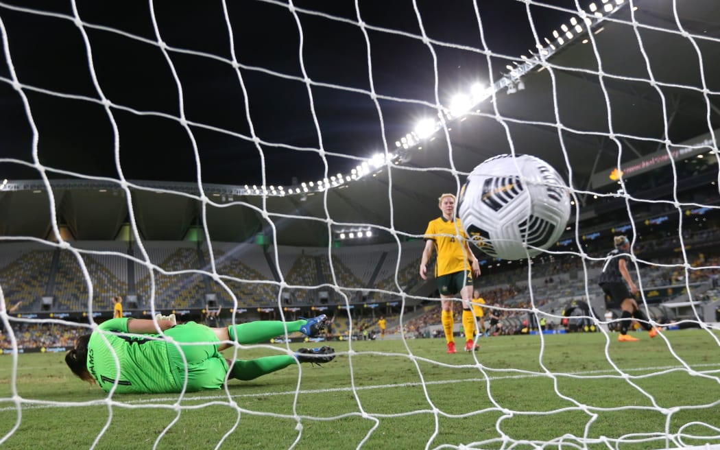 Matildas goalkeeper Lydia Williams  fails to make a save as Anna Green of New Zealand kicks a goal.