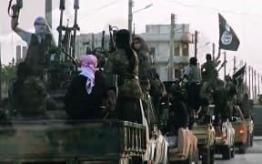 An image from an Islamic State video shows fighters entering Homs in 2014.