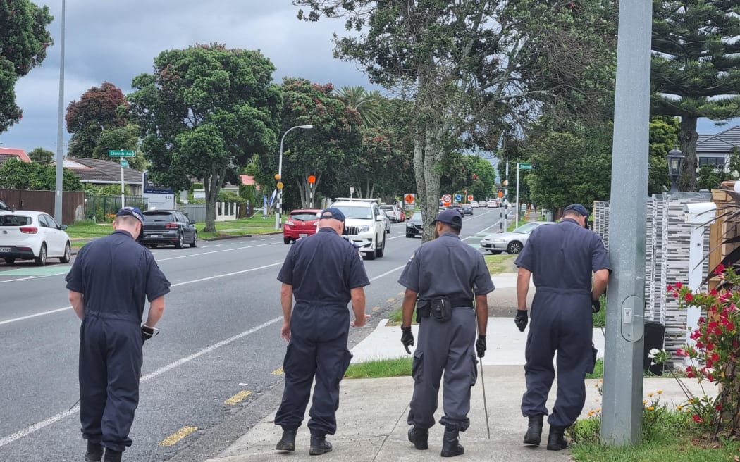 Armed police remain at the scene where a cordon at the Seventh Day Adventist Community Church's entrance is in place.