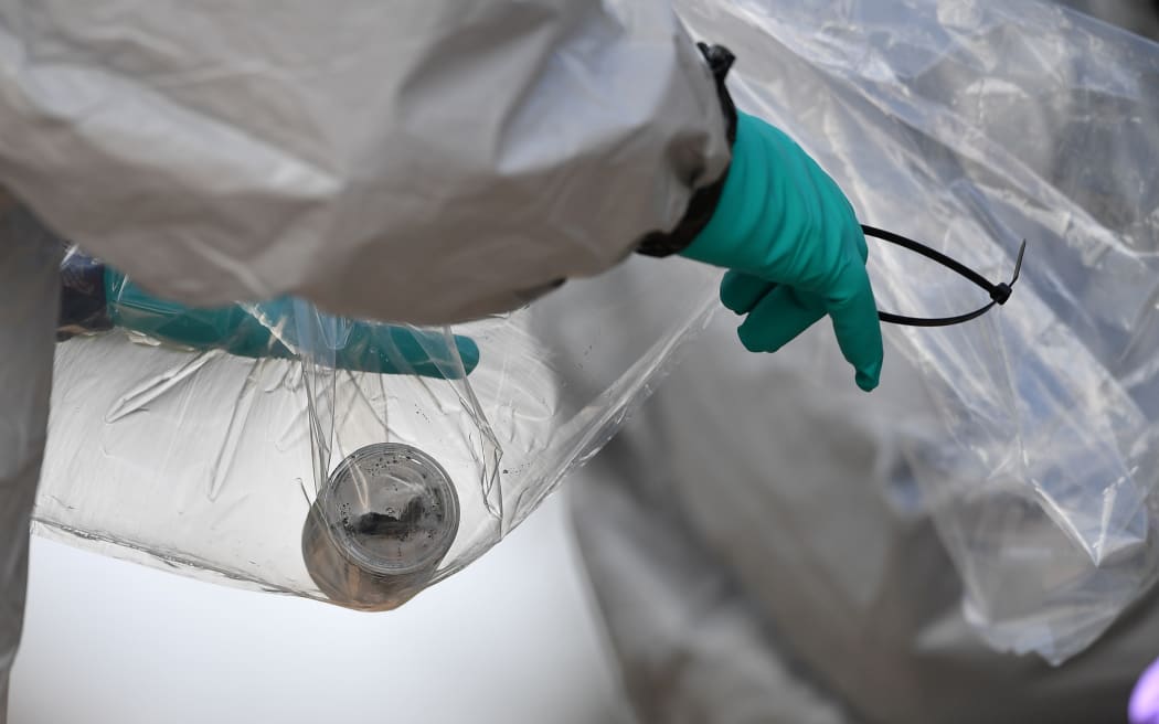 Samples are taken from a bench covered in a protective tent at The Maltings shopping centre in Salisbury, southern England, where former spy Sergei Skripal and his daughter Yulia were apparently poisoned.