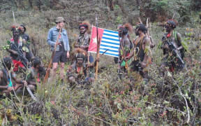 The West Papua National Liberation Army with Phillip Mehrtens. The flag is the Morning Star flag which is banned by the Indonesian government
