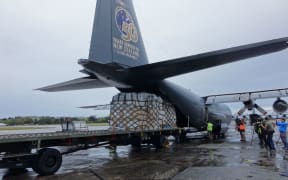 RNZAF Hercules C-130 loads aid relief bound for Vanuatu.