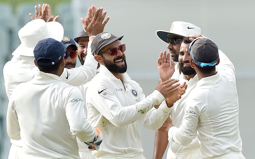 India's captain Virat Kohli (C) celebrates beating Australia in the first Test in Adelaide. 10 December 2018