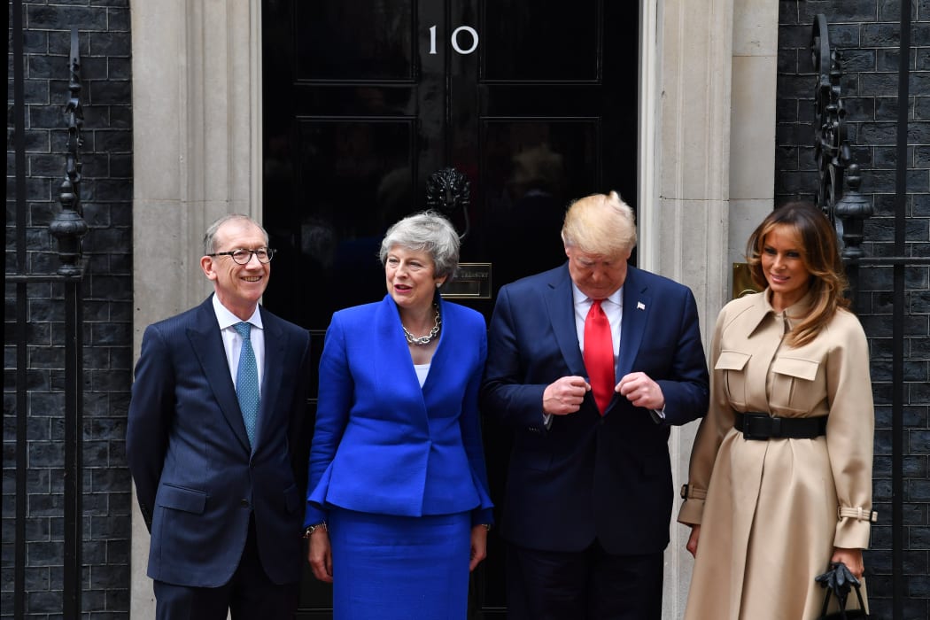 Britain's Prime Minister Theresa May and her husband Philip May greet US President Donald Trump and US First Lady Melania Trump.