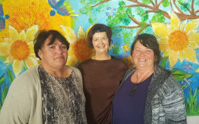 Family Works Whangarei social workers: Louise Walker, Margie Matthews and Michelle Arkin. Mural by their young clients.