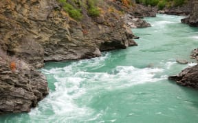 Two men got caught in rapids on the Kawarau River on an inflatable matress.
