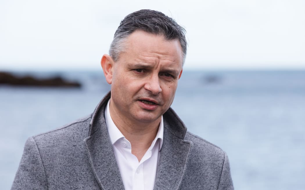 Climate Change Minister James Shaw speaks to media at Owhio Bay, which has been slammed by repeated storms, after revealing the National Adaptation Plan