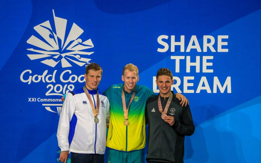 New Zealand's Lewis Clareburt wins bronze in the mens 400m medley. Australia's Clyde Lewis took gold, Scotlands Mark Szaranek Silver. Swimming, Optus Aquatics Centre, Commonwealth Games, Gold Coast, Australia. Friday 6 April, 2018. Copyright photo: John Cowpland / www.photosport.nz