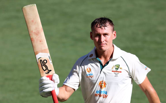 Australia's batsman Marnus Labuschagne acknowledges applauds from the spectators as he walks back to pavilion after dismissal on day one of the fourth cricket Test match between Australia and India at The Gabba in Brisbane on January 15, 2021.