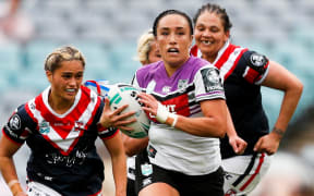 Krystal Rota playing for the Warriors against the Sydney Roosters in the NRL's women's premiership.
