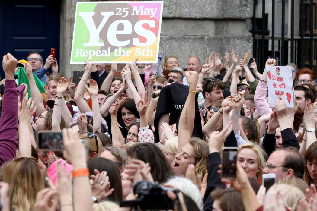 'Yes' campaigners celebrate the official result of the Irish abortion referendum at Dublin Castle in Dublin on May 26, 2018 which showed a landslide decision in favour of repealing the constitutional ban on abortions.