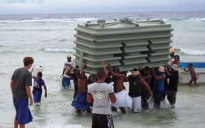 Water tanks arriving on Fais in Federated States of Micronesia to help community recover from super typhoon Maysak and prepare for climate change in future