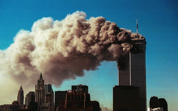Smoke pours from the twin towers of the World Trade Center after they were hit by two hijacked airliners in a terrorist attack September 11, 2001 in New York City.