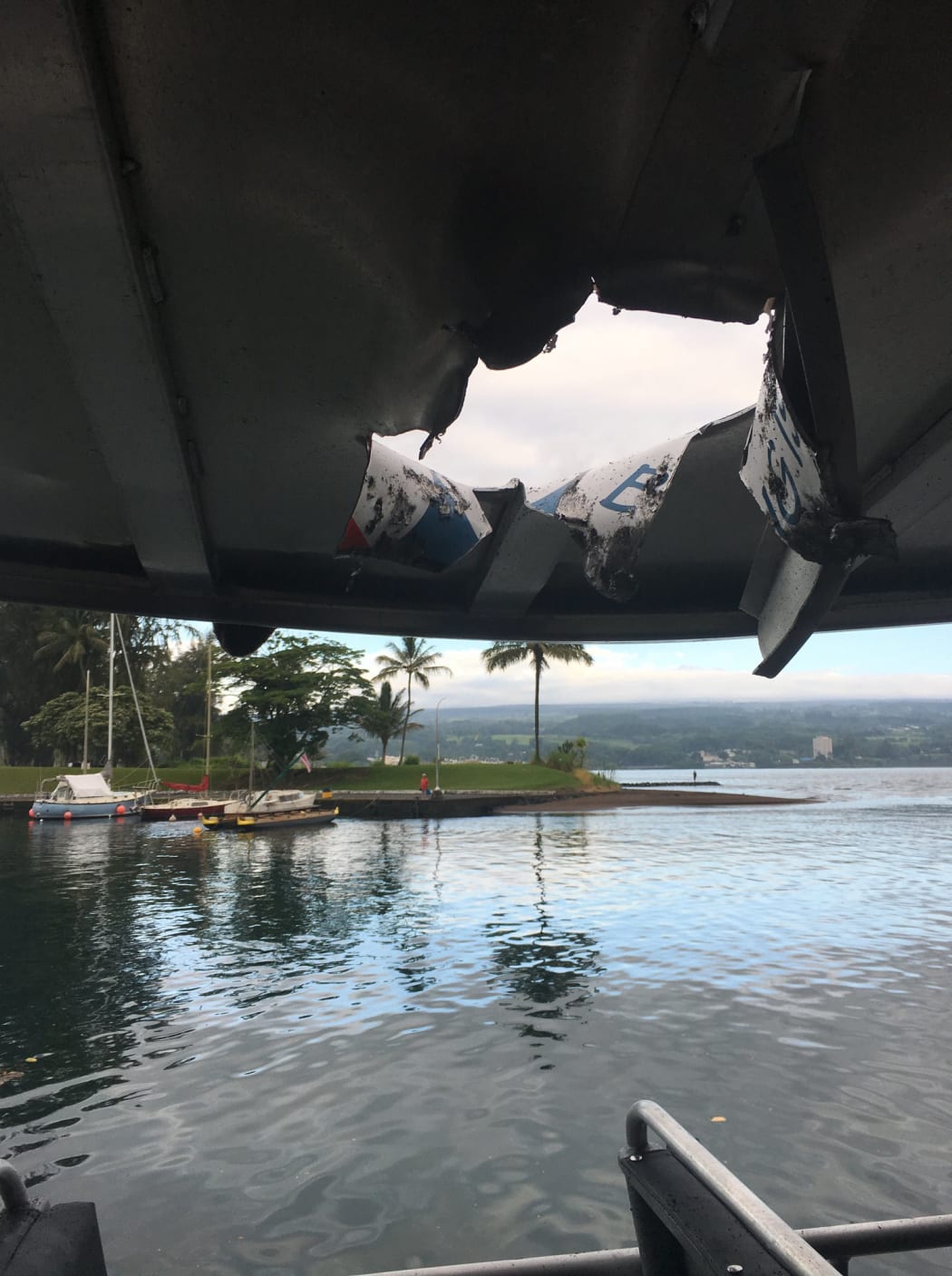 Rocks and debris in flying lava from the Kilauea volcano punched a hole through the roof of a tourist boat and injured passengers.