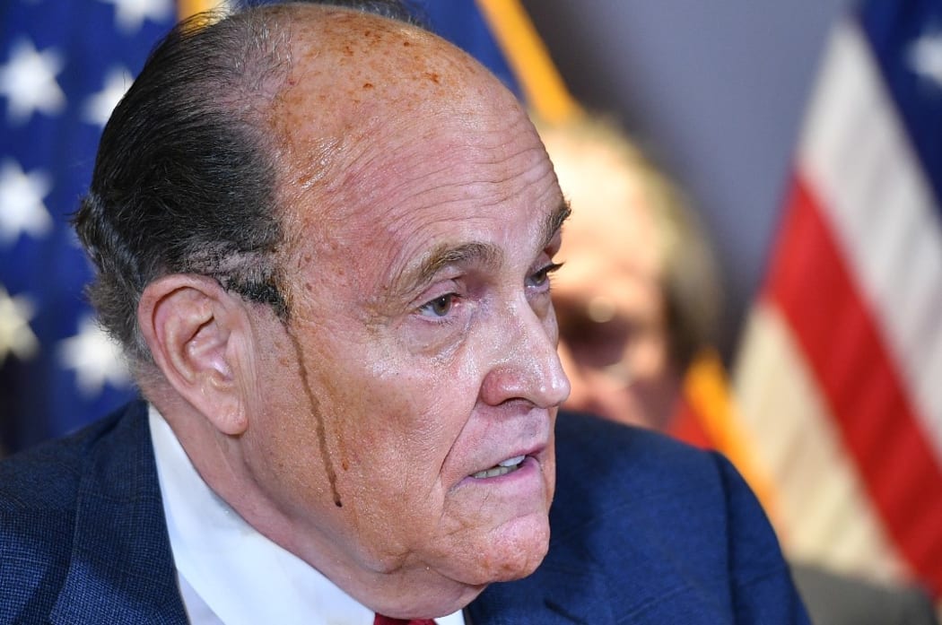 Trump's personal lawyer Rudy Giuliani perspires as he speaks during a press conference at the Republican National Committee headquarters in Washington, DC, on November 19, 2020.