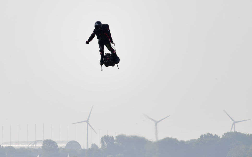 Franky Zapata stands on his jet-powered "flyboard" as he takes off from Sangatte, northern France, attempting to fly across the 35km Channel crossing in 20 minutes, while keeping an average speed of 140km/h at a height of 15-20m above the sea on July 25, 2019.