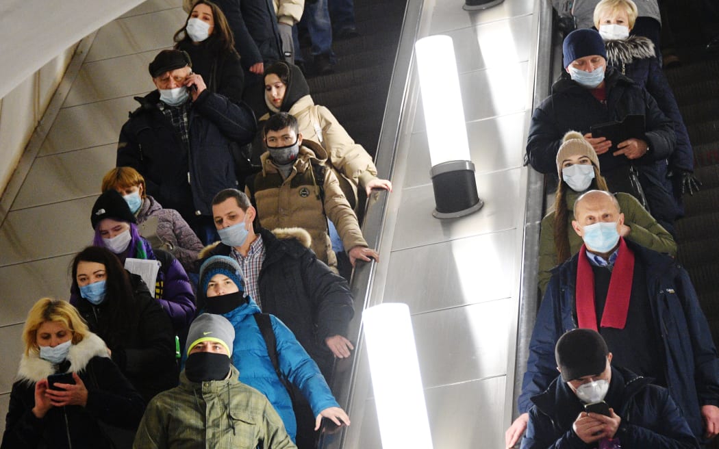 6446071 25.01.2021 People wearing protective face masks are seen in a subway amid coronavirus pandemic, in Moscow, Russia.