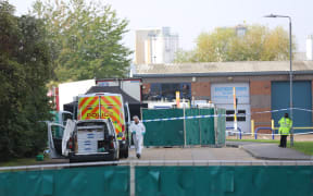 Police work at the industrial park in Essex where 39 bodies were discovered in the back of a lorry on 23 October.