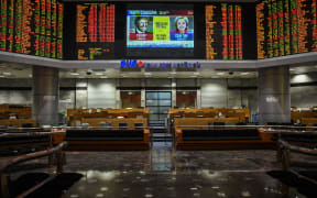 US presidential election at a private stock exchange in Kuala Lumpur on November 9, 2016. Share markets collapsed Wednesday and the dollar tumbled against the yen and the euro as Donald Trump looked on course to win the race for the White House