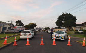 A cordon in Papatoetoe after a man was shot by police.