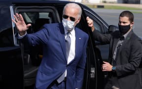 Joe Biden waves as he arrives at New Castle County Airport for his trip to Kenosha, Wisconsin, September 3, 2020 in New Castle, Delaware.  Jacob Blake, a Black man who was shot in the back 7 times by a police officer