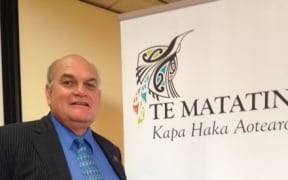 Te Matatini chairman, Selwyn Parata, next to the organisation's new brand.