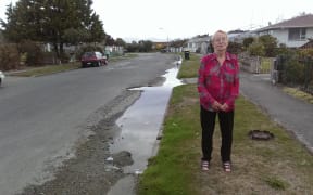 Joyce Fuller's street has had a constant flood of water ever since a spring came up in a neighbour's property in the earthquakes four years ago.