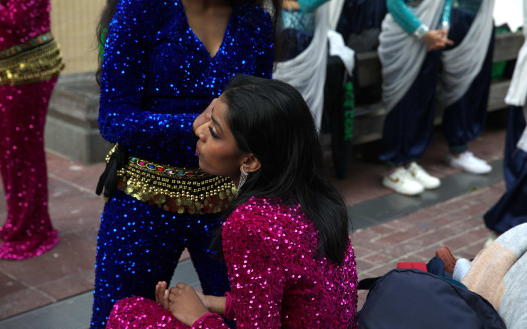 Dancers at the Diwali festival apply make-up backstage as they prepare for their performance.