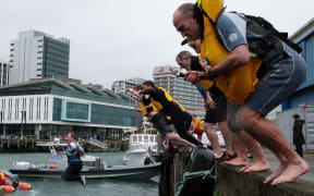 Volunteers take the dive into Wellington harbour on a chill spring morning to boost water safety awareness.