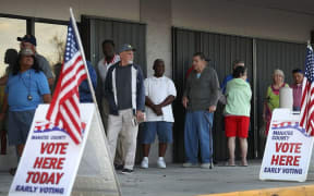 Voters line up to vote early at the Supervisor of Elections office on October 24, 2016 in Bradenton, Florida.