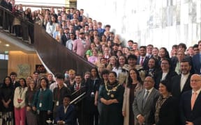Prime Minister Jacinda Ardern and Governor-General Dame Cindy Kiro pose mask-less with MPs and Youth MPs.