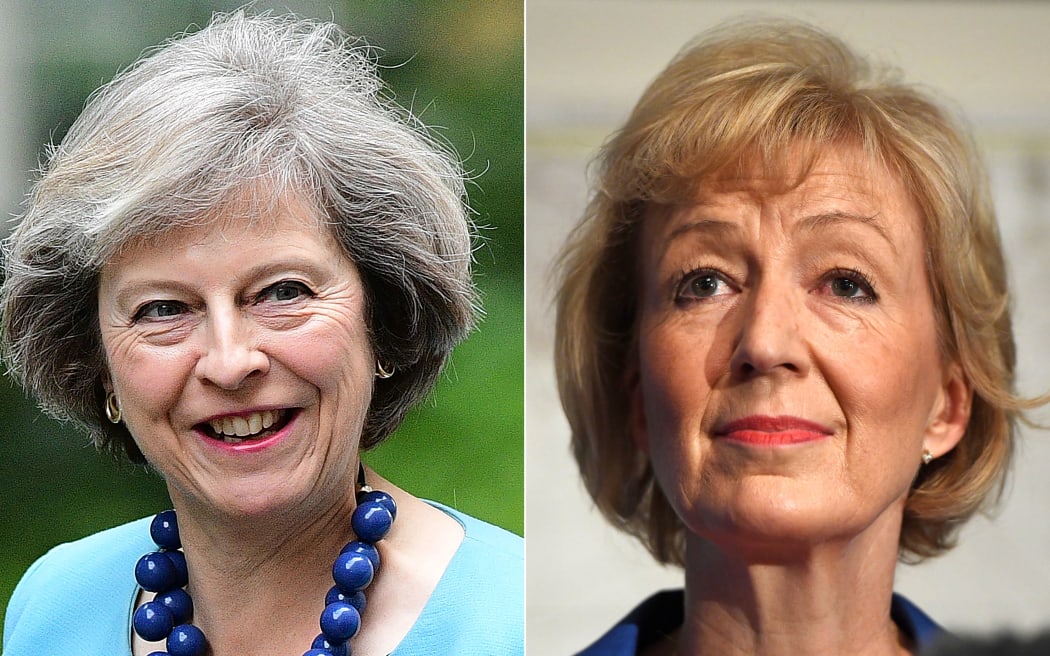In this combination of file pictures created on July 7, 2016, British Conservative Party leadership candidate Theresa May (L) arrives to attend a cabinet meeting at 10 Downing Street in central London on June 27, 2016 and British Conservative Party leadership candidate Andrea Leadsom (R)