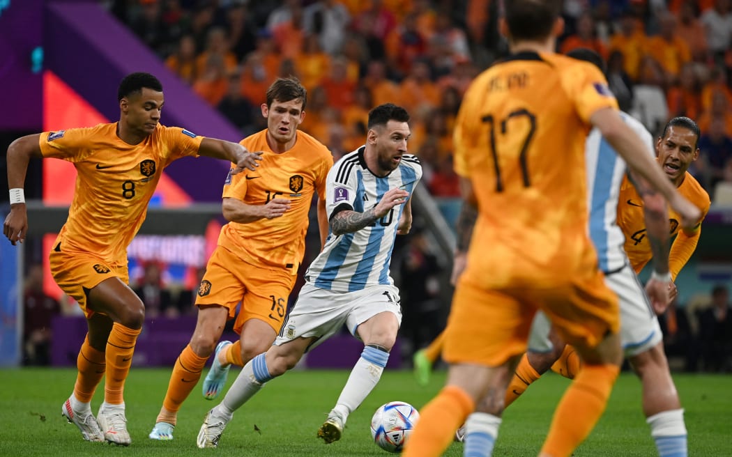 Argentina's Lionel Messi on the ball in the first half during the FIFA World Cup quarter-final match Netherlands vs Argentina at Lusail Stadium in Al Daayen, Qatar on 9 December, 2022.